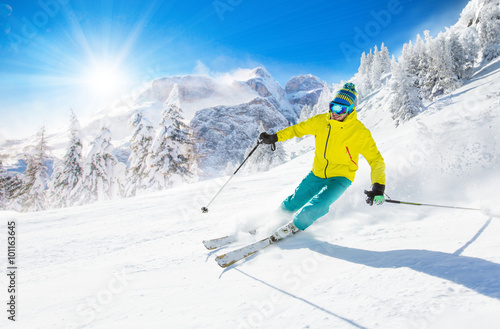 Skier skiing downhill in high mountains © Lukas Gojda