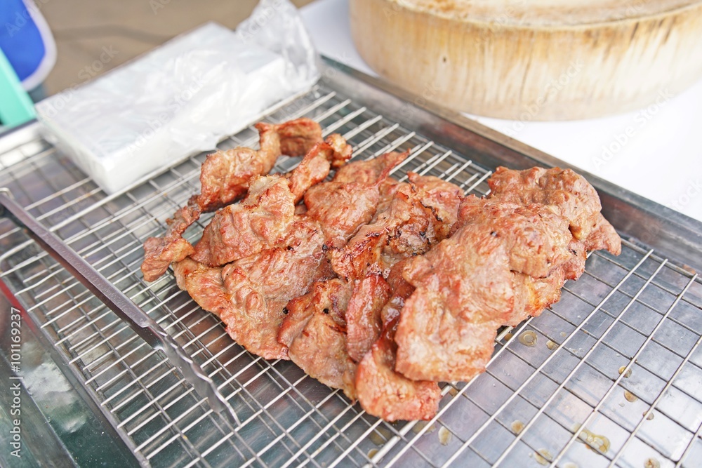 Grilled pork ribs on steel tray - delicious toasted traces - thai style Grilled pork ribs on steel tray - delicious toasted traces - thai style