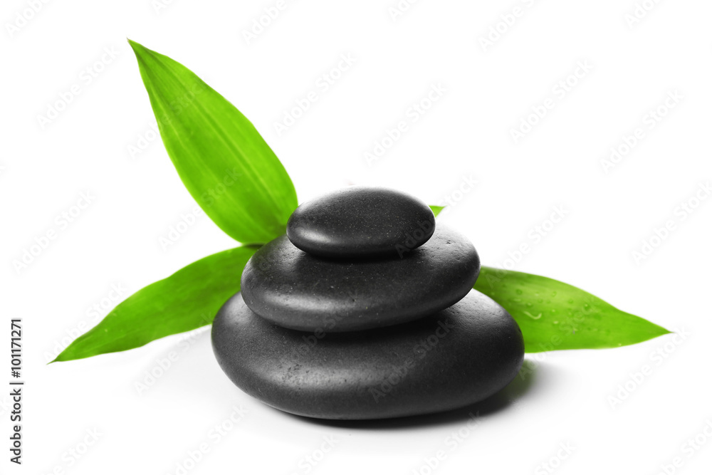 Hot spa stones with bamboo, isolated on white Hot spa stones with bamboo, isolated on white