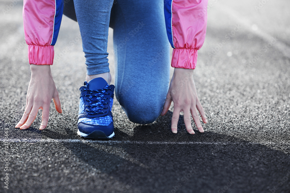 Sports woman legs in running movement