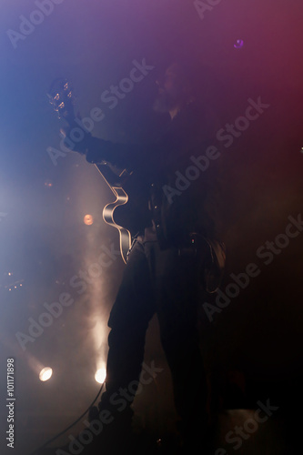 Guitarist plays on rock concert © Africa Studio