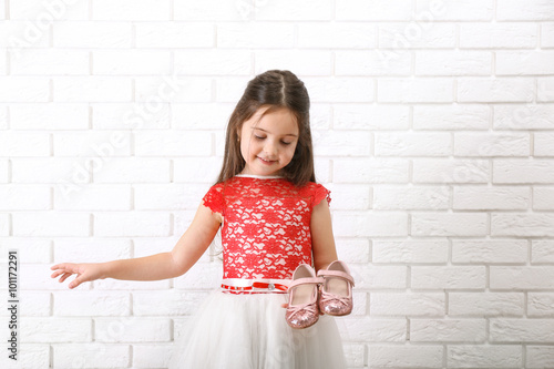 Little girl in dress on a w...