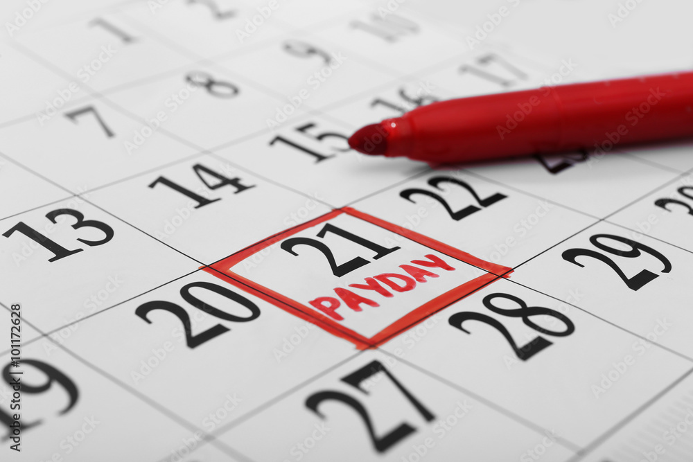Payday concept. Calendar with red felt pen background. Date in frame, close up Payday concept. Calendar with red felt pen background. Date in frame, close up