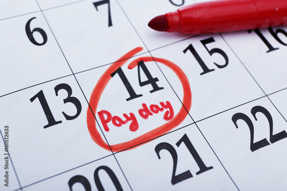 Payday concept. Calendar with red felt pen background. Date in frame, close up Payday concept. Calendar with red felt pen background. Date in frame, close up