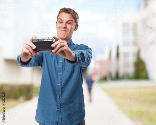 happy young-man taking a selfie with camera