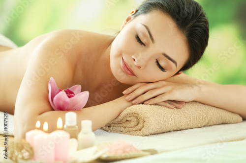 Spa concept. Young pretty woman relaxing  close up