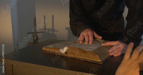 Monk, Man in Black, Hands Closeup, Touches The Book, Nestor the Chronicler's book 