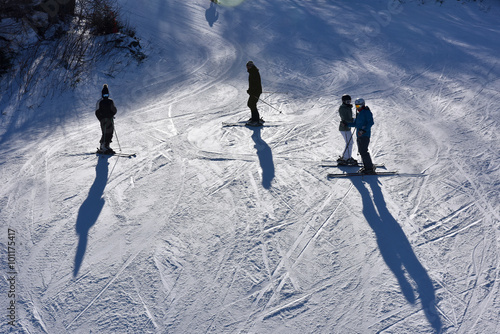 Unidentified skiers standing on the slopes at the Loon Mountain in New Hampshire, USA..