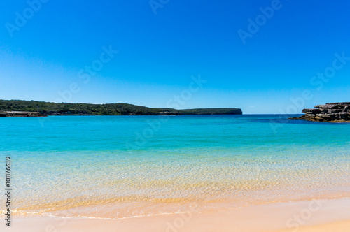 Pristine beach with clear water © Olga K