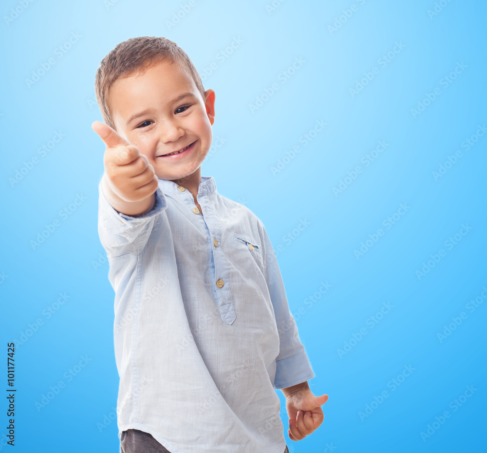 portrait of a little boy doing okay gesture portrait of a little boy doing okay gesture