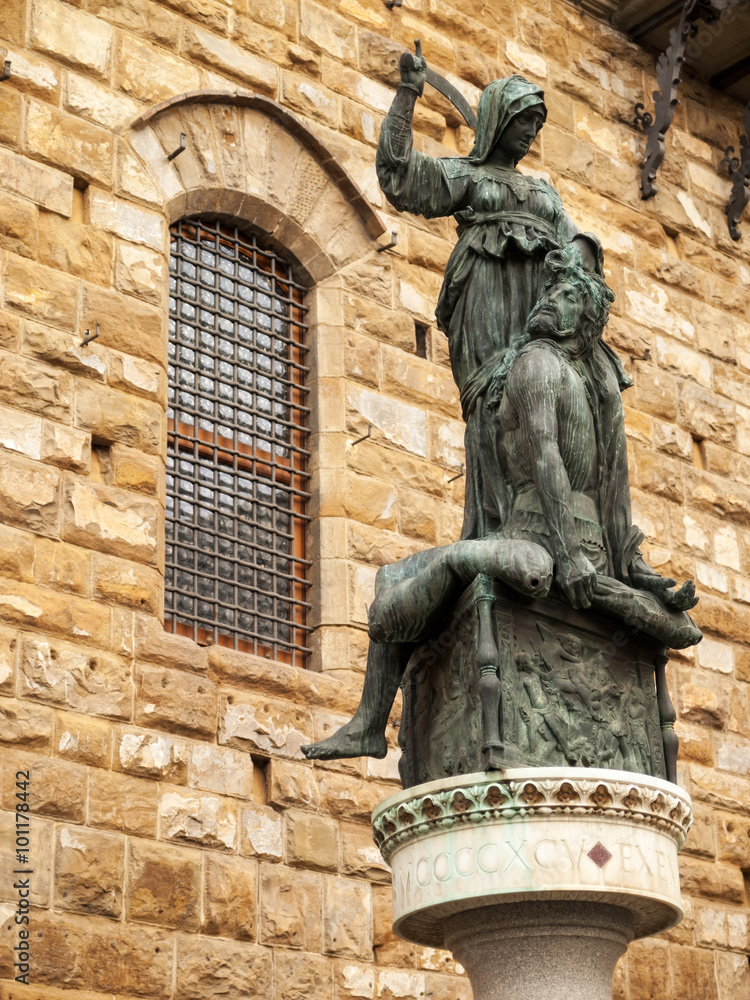Naklejka premium Sculpture in front of the stone wall. Florence, Italy