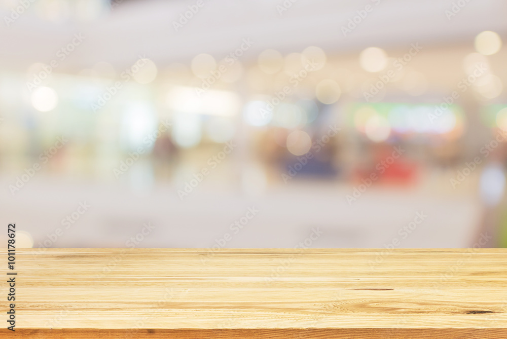 Wood table top on sunlight bokeh background - can used for displ