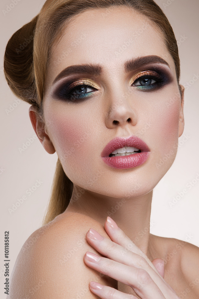 Glamour portrait of beautiful girl model with makeup and romantic wavy hairstyle. Fashion shiny highlighter on skin, sexy gloss lips make-up and dark eyebrows. Glamour portrait of beautiful girl model with makeup and romantic wavy hairstyle. Fashion shiny highlighter on skin, sexy gloss lips make-up and dark eyebrows.