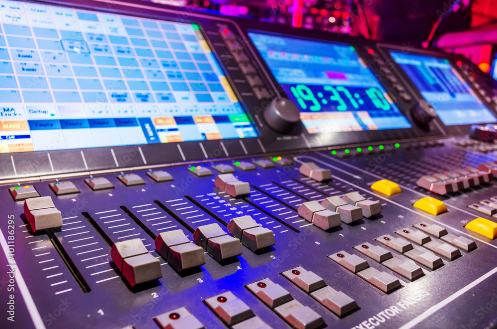 Professional audio sound mixer with buttons and sliders . Selective focus . A little of DOF.