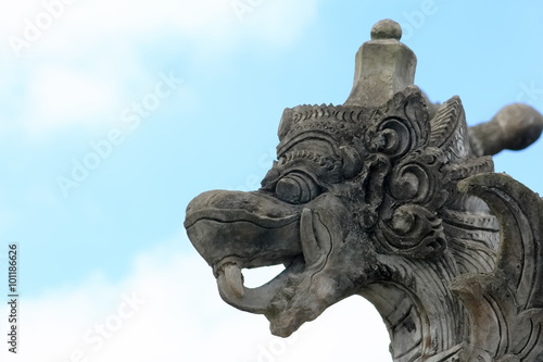 Elaborate dragon head stone in the park