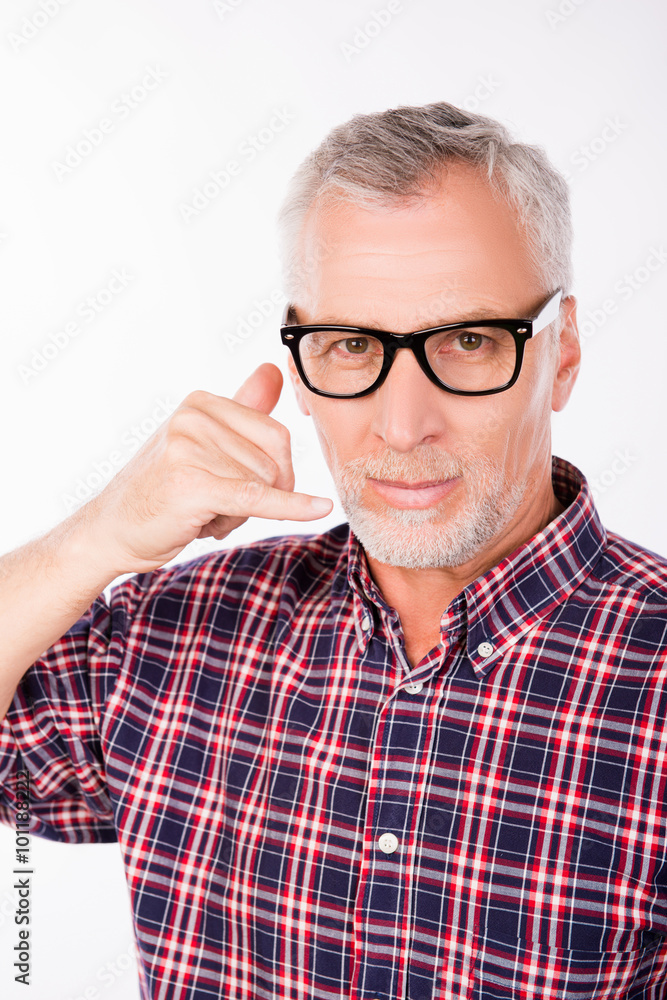 Gray aged man with glasses asking to call him Gray aged man with glasses asking to call him