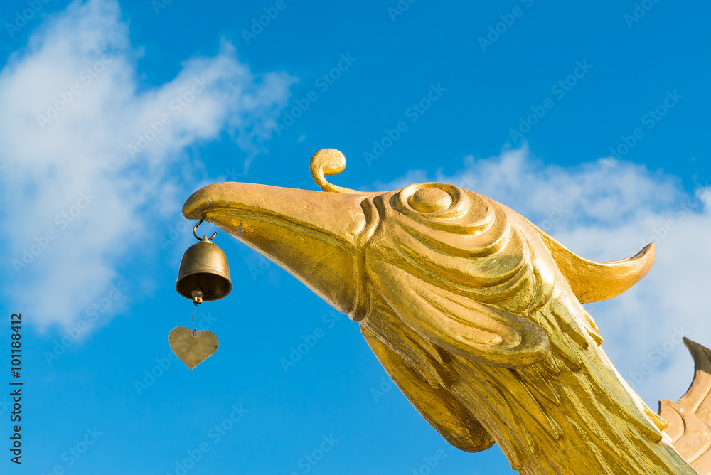 Crane bird with bell statue