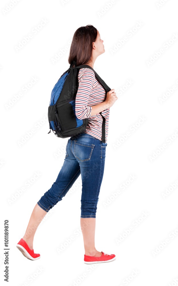 back view of standing young beautiful brunette woman with backp back view of standing young beautiful brunette woman with backp
