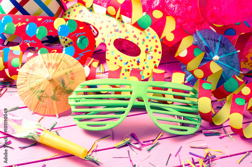 Colorful party decoration on pink background