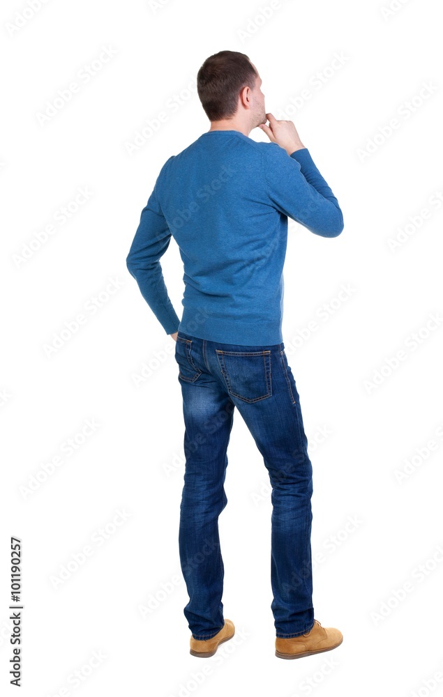 Back view of handsome man in blue pullover. Back view of handsome man in blue pullover.