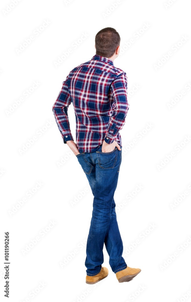 Back view of handsome man in checkered shirt looking. Back view of handsome man in checkered shirt looking.