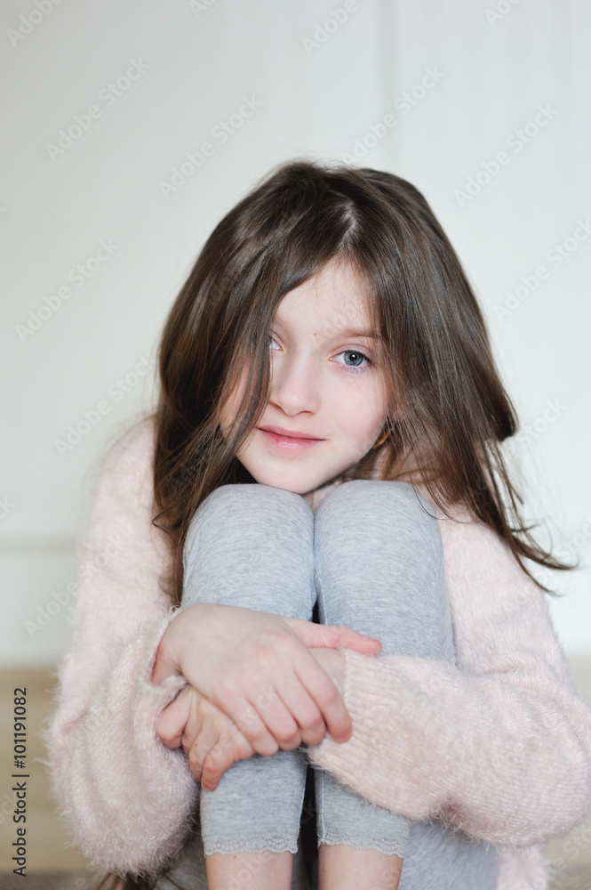 Portrait of beauty school aged brunette kid girl with blue eyes indoor Portrait of beauty school aged brunette kid girl with blue eyes indoor