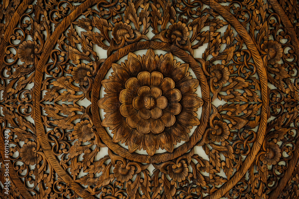 Pattern of flower carved on wood background