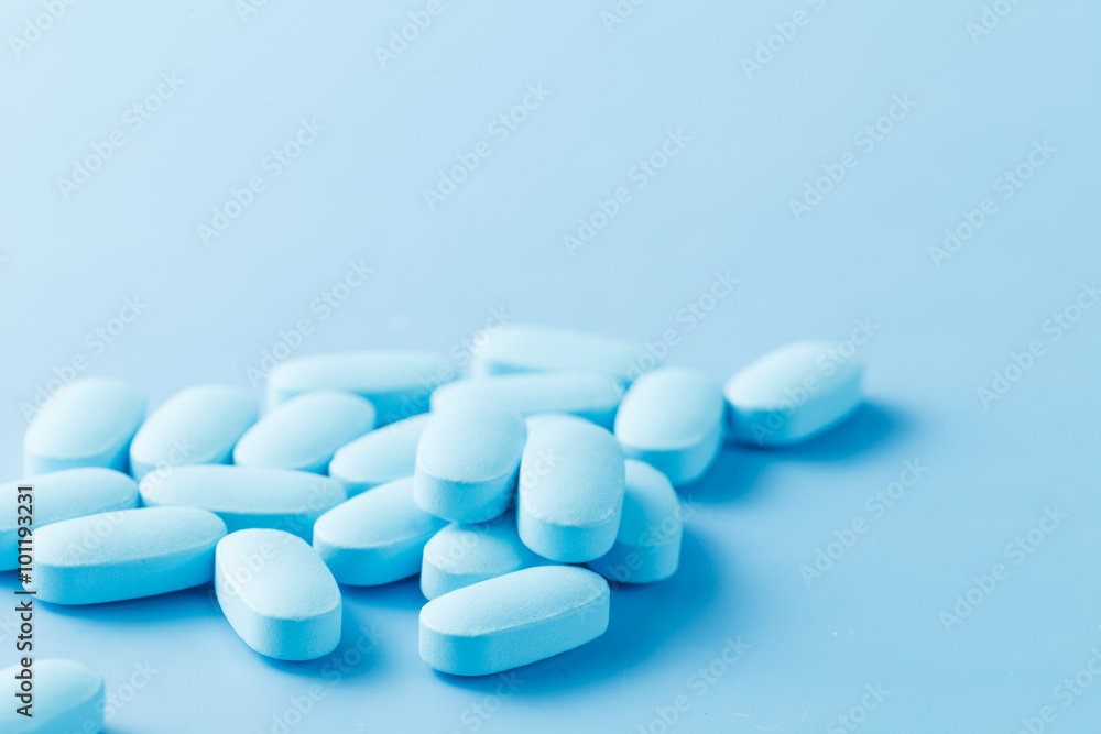 pile of little oval blue pills