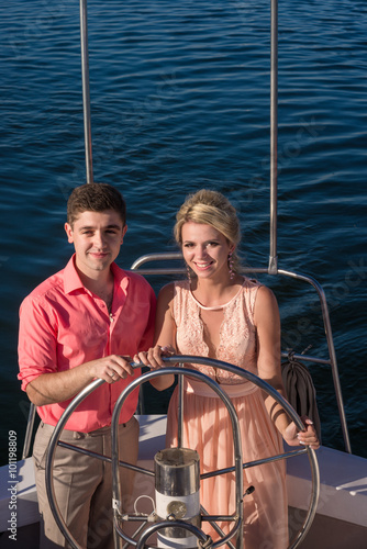 Man and woman lead yacht