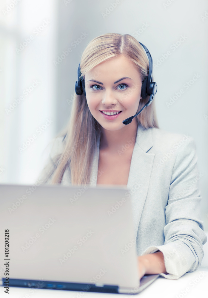 friendly female helpline operator with laptop