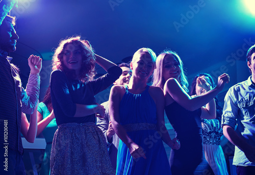 Konstfotografi group of happy friends dancing in night club