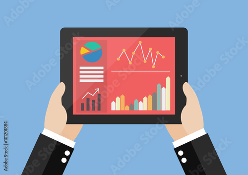 Hands hold tablet with flat simplistic inforgraphic charts on a