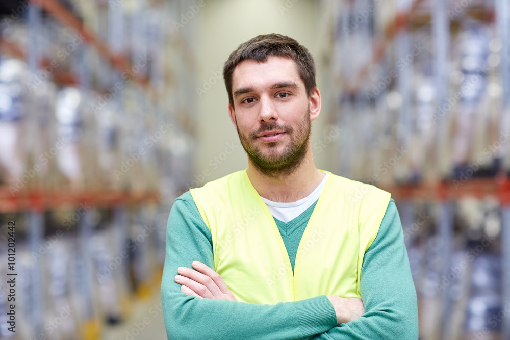 happy man in reflective safety vest at warehouse happy man in reflective safety vest at warehouse