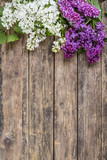 Lilac flowers on rustic boards, floral background