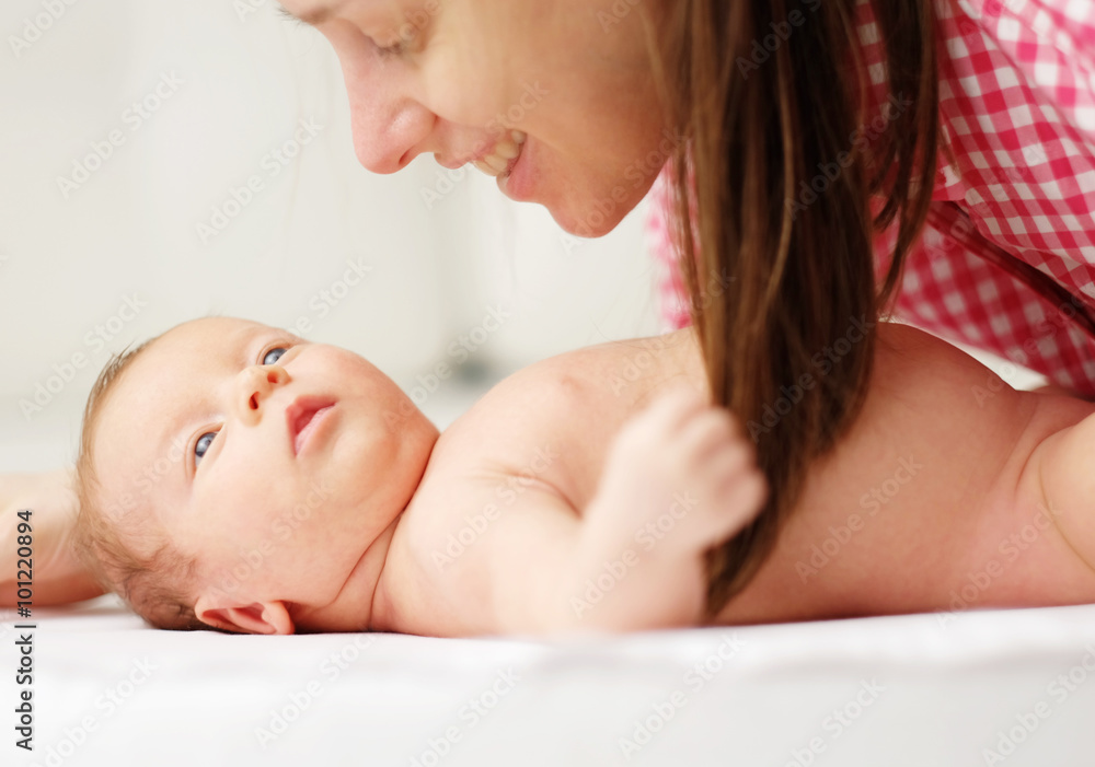 One month old newborn baby with mother One month old newborn baby with mother