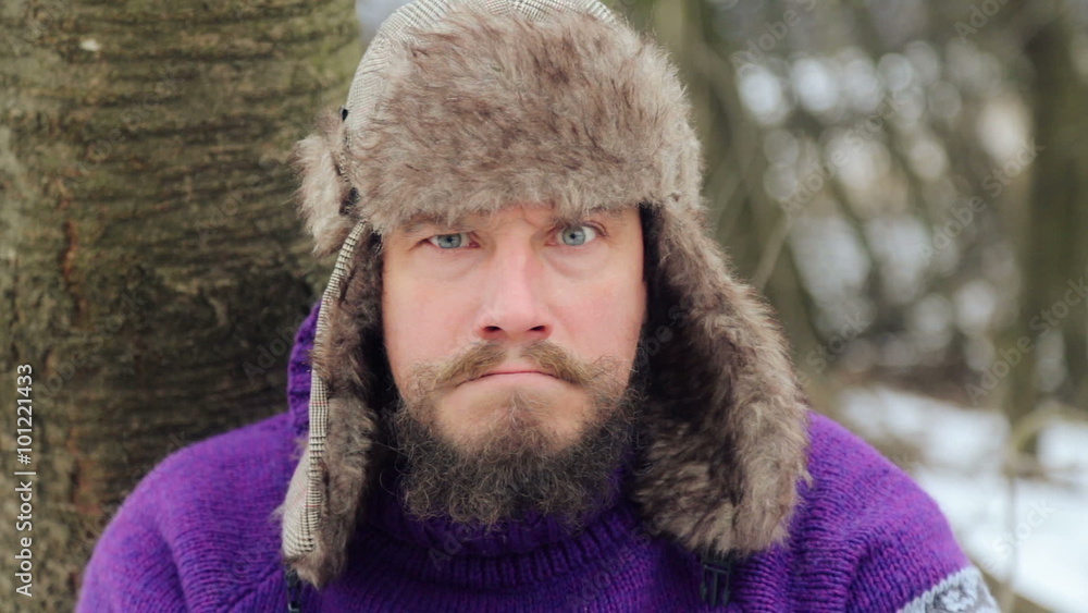 Emotional bearded man looking into the camera, swearing, smoking, laughing. The face of a bearded emotional man in winter.
Emotional bearded man looking into the camera, swearing, smoking, laughing. The face of a bearded emotional man in winter.