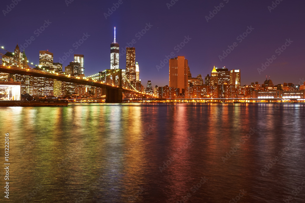 Brooklyn Bridge with lower Manhattan skyline at night