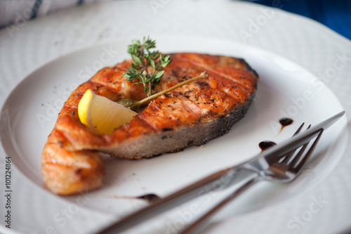 Grilled humpback salmon with a lemon slice