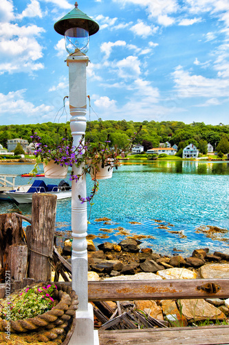 New England coastal village waterfront summer day. Vertical photo