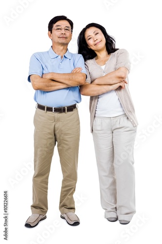 Smiling couple with arms folded