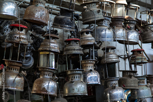 Many old petroleum lamps for repairs and spare parts on a souk in Sfax, Tunisia photo