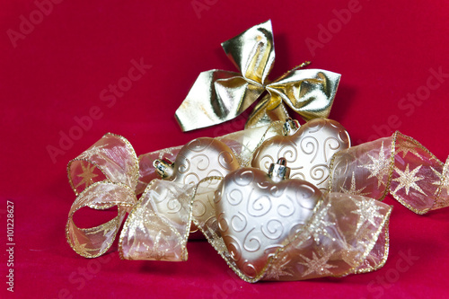 gold New Year's hearts and decorative ribbon