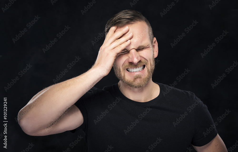 Headache. Portrait of a man with face closed by hand. Headache. Portrait of a man with face closed by hand.