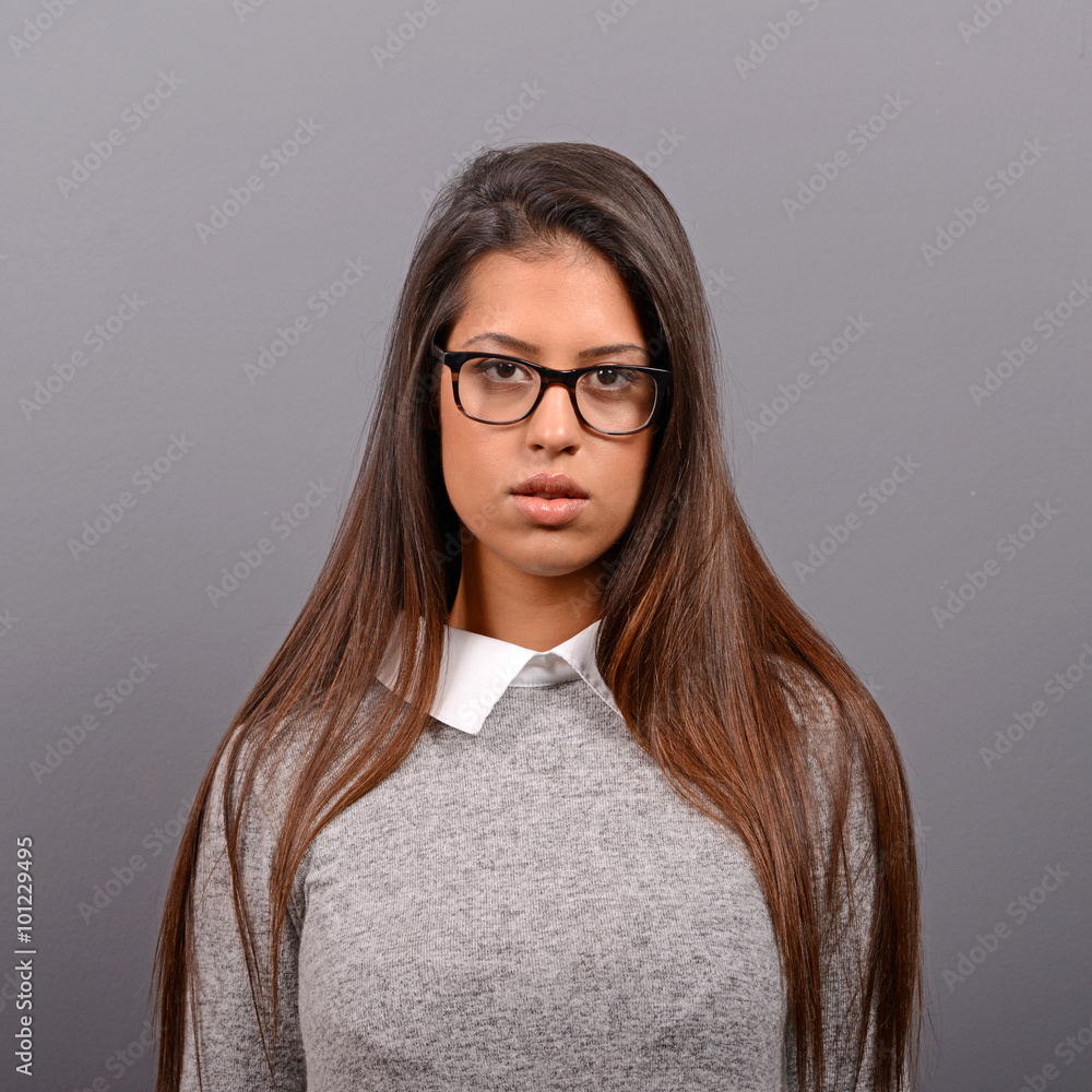 Portrait of a smiling business woman against gray background Portrait of a smiling business woman against gray background