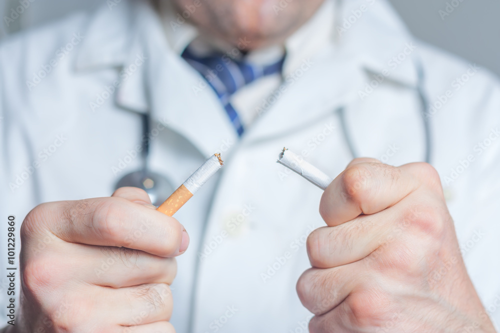 Doctor breaking a cigarette Doctor breaking a cigarette