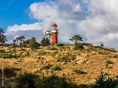 Vuurduin lighthouse  on Vuurboetsduin near East-Vlieland town on the West Frisian island Vlieland in Wadden Sea, Netherlands photo