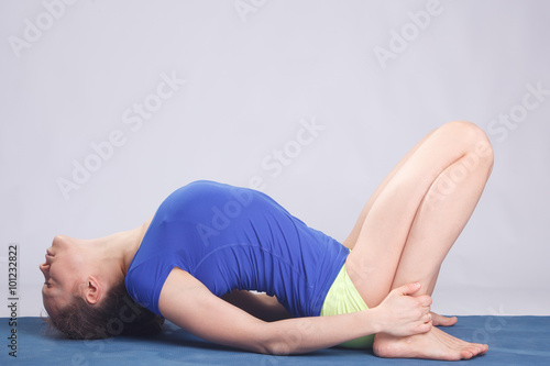 Woman practicing advanced yoga