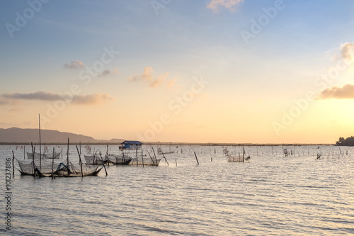 Twilight The bamboo coop for feeding fish. in south of Thailand sea. Songkhla  Koh-Yor