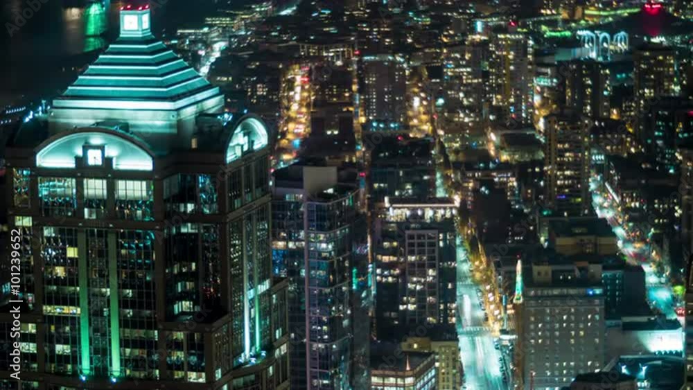 Aerial Bird's Eye view of Downtown City Streets at Night with Skyscraper Building in Cityscape Time-lapse Aerial Bird's Eye view of Downtown City Streets at Night with Skyscraper Building in Cityscape Time-lapse