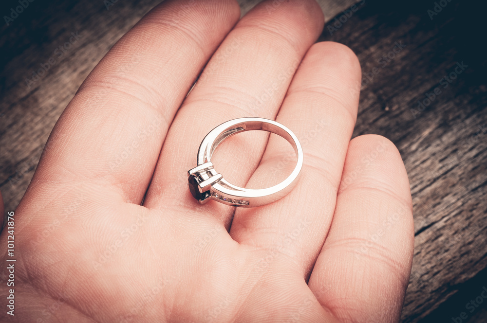 Engagement ring in palm of hand Engagement ring in palm of hand